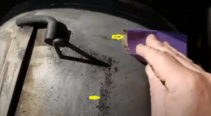 Smothen rusted area of the firebox with sandpaper.